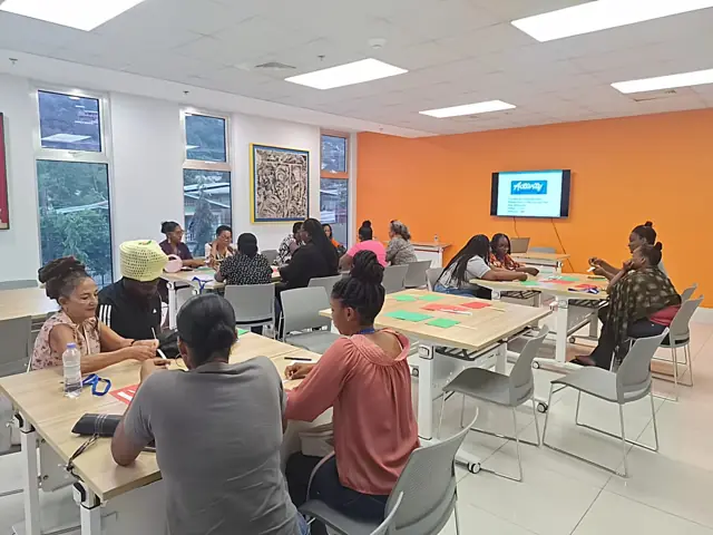 Teachers working with cards at their tables