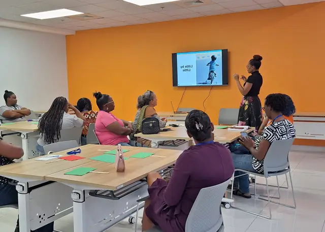 A presenter leading the “Little by little” session for teachers
