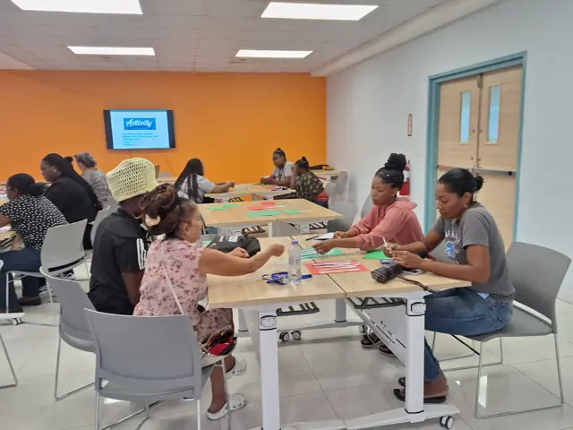 Teachers working in groups at their tables